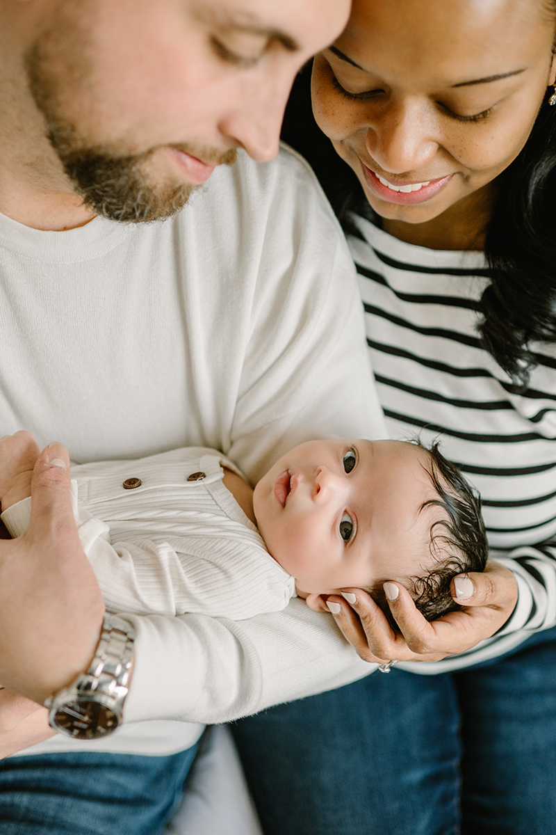 Windsor Ontario Newborn Photographer captures session at home with Mom, Dad and new baby