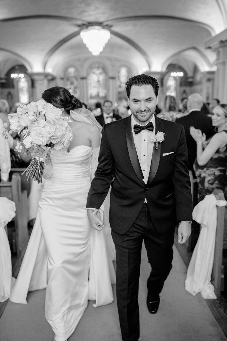 Bride and Groom walking down aisle at St. Angelas Church